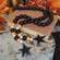 Black, Orange, & White Bead Garland with Star Tags