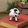 Resin Black & White Cow Sitter